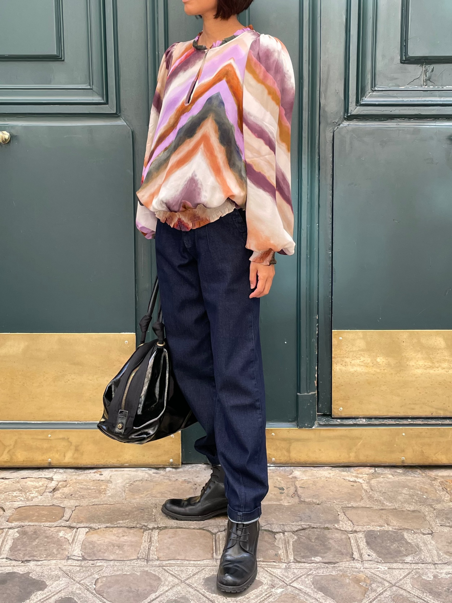 Flowing top with multicolored geometric patterns