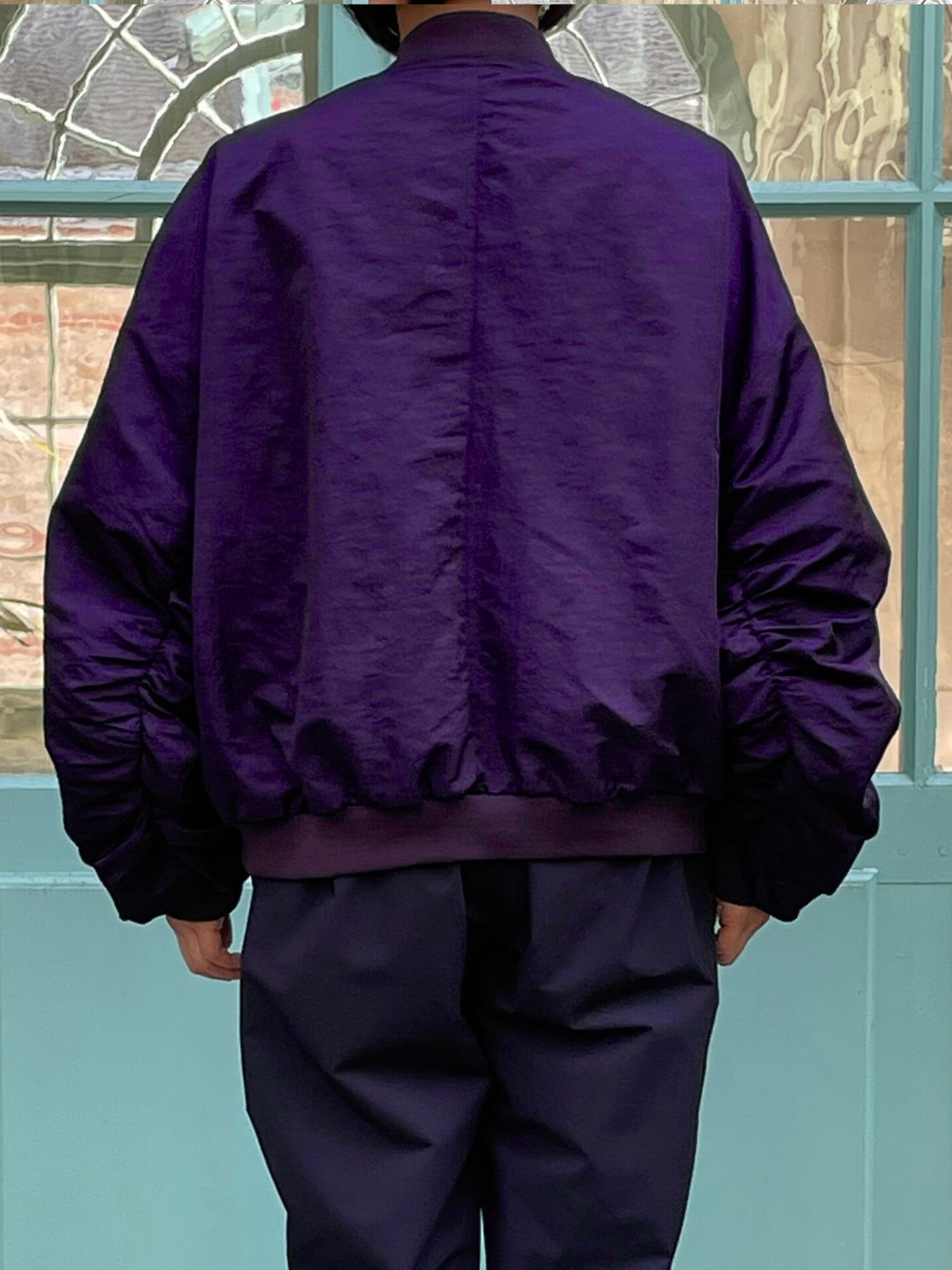 Bomber jacket with gathered sleeves and front zip